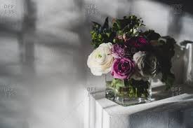 White faux flowers in white vase illustration, floral design vase flower bouquet jin jun mei tea, vase transparent background png clipart. Purple And White Flowers Arranged In A Square Glass Vase Stock Images Page Everypixel
