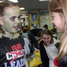 Zombies and superheroes take to the ice at Highland Park's Scary Skate