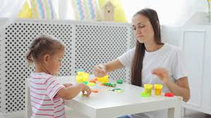 Image result for photo of mother and children playing in living room