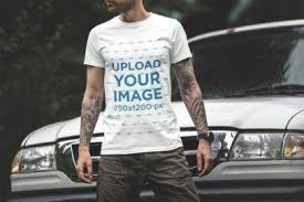 Placeit T Shirt Mockup Featuring A Tattooed Man Standing In Front Of A Truck In 2020 Shirt Mockup Tshirt Mockup Mockup Generator