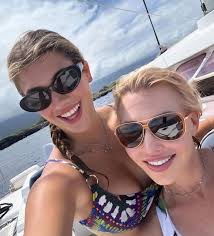 Chiefs heiress Ava Hunt goes luau dress twins with mom Tavia