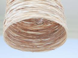 We've got another lamp update we're excited to share the results from today — this go round, we replaced the hanging fixture in our upstairs hallway with an industrial pendant light i made. Make These Easy Diy Raffia Pendant Lights Dossier Blog