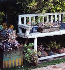 Create a handy potting bench fashioned from old kitchen shelving, reimagine a cot mattress base into a vertical planter or craft a corner sofa from pallets. Recycling Old Chairs And Benches For Blooming Garden Decorations