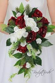 We have a green rose tinted for valentine's day, although it can be used in arrangements. Cascading Brides Bouquet With Dark Red Silver And White Roses Accented With Greenery Perf Bridal Wedding Flowers Flower Bouquet Wedding Wine Wedding Flowers