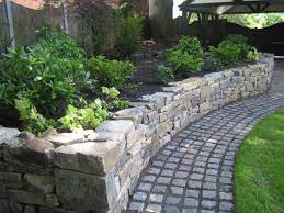 Dressed Dry Stone Raised Planting Bed And Granite Cobbled Sett Path From A Design By Sue Davis Of Outside Room Garden Stones Dry Stone Wall Front Garden Design
