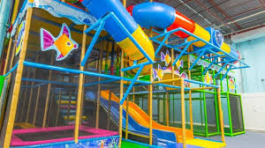 Big Play Structure With Tubes And Slides And Decorated With Fish Indoor Playground Playground Indoor Fun
