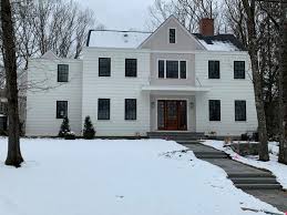 The shingle siding on upper floor works beautifully. The Colonial House Is Trending Modern