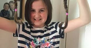 East Kilbride schoolgirl goes for the chop for cancer charity and raises  over £1700