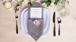 To fold a cloth napkin so it has a pocket for silverware, start by spreading the napkin out on a flat surface and folding it in half twice so it looks like a small square. Table Setting Tips Menu Napkin Folds Diamond Pouch Fold Youtube