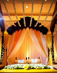 Bengali Wedding Guide Gaye Holud Or Turmeric On The Body Stage Decoration Idea Stage Decorations Wedding Stage Decorations Wedding Decorations