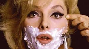 Young beautician removing facial hair with a laser to her client in the beauty salon. Should Women Shave Their Face My Life After Coffee