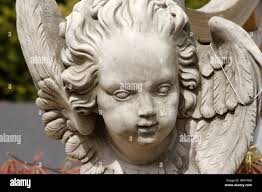 Garden angel stone statue hi-res stock photography and images