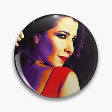 Nancy Ajram in red dress with signature Pin