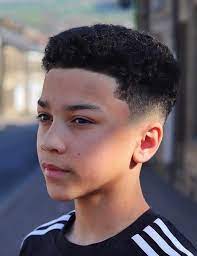 Black Curly Hair Types Of Haircuts For Men Black Shirt White Stripes Blurred Background Boys Haircuts Popular Boys Haircuts Spring Hair Trends