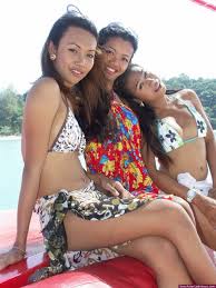 Three cute ladyboys guide us in a tropical cruise in the south of Thailand