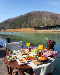 Image May Contain 1 Person Sitting Table Sky Outdoor Nature Water And Food Turkish Breakfast Best Dishes Turkey