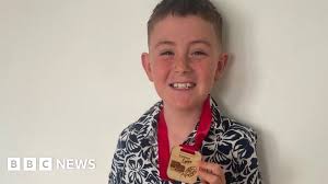 Boy who lost pregnant mum in crash walks 100km for charity