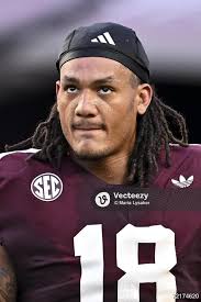 Texas A&M Aggies defensive end T.J. Searcy (18) looks