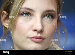 Actress Julia Roy sits