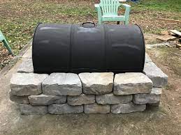 Since replacement grates are easy to find at most any hardware store, as are many of the nuts and bolts we'll use. Inexpensive Fire Pit Made From A 55 Gallon Drum A Grate From Northern Tool And Blocks From Lowe S 55 Gallon Drum Fire Pit Fire Pit Backyard