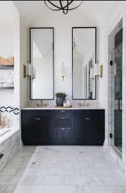 Black And White Contrast High Ceilings Need Tall Gestures The Mirrors Over The Sinks Exten Painted Vanity Bathroom Bathroom Interior Design Bathroom Interior