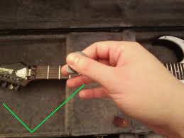 Holding the pick between the tips of your index finger and thumb is the best way to acheive this. How To Hold A Guitar Pick A 3 Step Guide For Beginners Guitarmeet