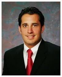 Holcomb receives commercial investment designation