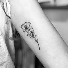30 Botanical Floral Lily Tattoo Designs On Arms Bring A Touch Of Elegance Lily Flower Tattoos Lily Tattoo Design Lily Tattoo