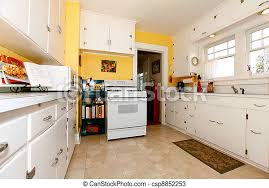 The simple kitchen design like this is a great choice to have, you only need 2 or 3 cabinets and stove as the kitchen area, that's it! White And Yellow Old Simple Kitchen White Old Small Simple Kitchen Interior With Yellow Walls Canstock