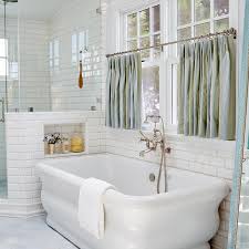 You can simply put up a spring loaded shower curtain rod and hang a curtain. Freestanding Tub Under Window Dressed In Blue Cafe Curtains Transitional Bathroom