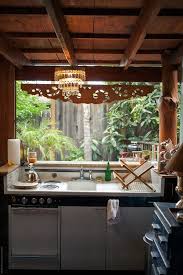 Give us a call today, and let's discuss your custom made rustic kitchen. Rustic Outdoor Kitchen In Backyard By Rzcreative Stocksy United