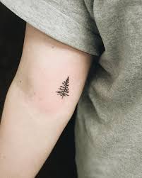 12 Of The Cutest Tiny Tattoos Perfect For First Timers In 2018 Simple Tree Tattoo Tree Tattoo Small Tree Tattoo Arm