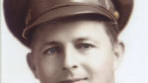 Glidden native honored with flag raising