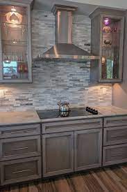 Stack them up somewhere out of the way. Glass Doors Frame This Sleek Cooktop And Hood Featuring Our New Storm Stain Grey Cabinets Gray Stained Cabinets Kitchen Cabinets Painted Grey