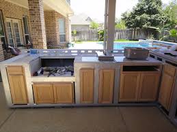 If you have the boards and steel, you can construct your own outdoor kitchen without spending anything and then just add an off the shelf grill and maybe a small dorm fridge. Building Outdoor Cabinets Www Macj Com Br