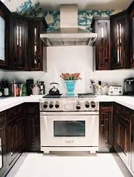 Modern new brown kitchen with black and concrete wall kitchen and dining room interior with a wooden floor, brown closets with kitchen contemporary style. Dark Chocolate Cabinets Eclectic Kitchen Lonny Magazine
