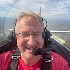 NASA research pilot Milt Thompson sits in the M2-F2 lifting body research  vehicle before a 1966 test flight. The M2-F2 was attached to a wing pylon 