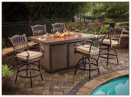 Fire pit tables are elevated higher from the ground than more traditional fire pits. Bar Height Fire Pit Table Set