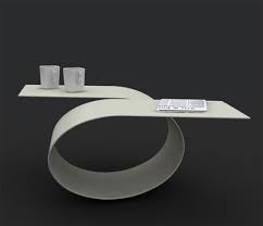 The style of this table is very cute. Futuristic Coffee Table With Amazing Curves Loop By Baita Design Stylish Coffee Table Cool Coffee Tables Coffee Table Design Modern