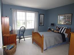 In this interior, dark wood floors and furniture make dusky blush and salmon pink look especially vivid. More Cool Blue Paint Colors For Boys Bedrooms Nice Bedroom Design Good Ideas Room Interior And Deco Boys Bedroom Colors Boy Room Paint Girls Room Colors Scheme