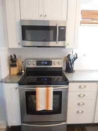 How To Install An Over The Range Microwave With No Cabinet Microwave Shelves Over Modern Chrome Kitchen Appliance Set Kitchen Furnishings Kitchen Design