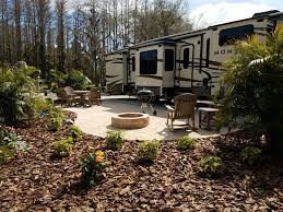 Expansive And Lush Landscaping Surround This Rv Patio Site At The Clearwater Lake Tarpon Koa Backyard Rv Lots Patio