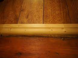 How To Make A Custom Wooden End Cap For Transitions Between Laminate Flooring And Other Floors Flooring Floor Trim Home Diy