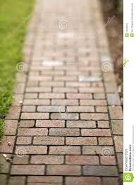 The entire front patio and walkway including the border have all been built out of the same red brick. Red Brick Walkway Download From Over 57 Million High Quality Stock Photos Images Vectors Sign Up For Free Today Brick Walkway Garden Walkway Brick Pathway