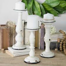 Each round base has a turned column silhouette inspired. Distressed White Metal Candle Holders Set Of 3 Kirklands
