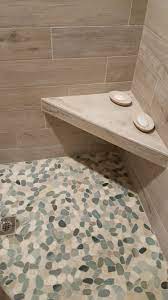 Each Pebble Is Carefully Selected And Hand Sorted According To Color Size And Shape In Order To Ensure The Shower Floor Tile Shower Floor Pebble Shower Floor