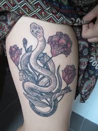 Here, snake tattoos are juxtaposed with real snakes that firmly blur the lines between nature and art. 150 Sexy Thigh Tattoos For Women Mind Blowing Pictures