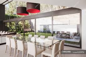 A stylish modern country dining room with a trestl table, grey chairs, a metal chandelier, an inlaid console and a round mirror. Dining Room In Modern House Design Backdrop Stock Photo 199386802