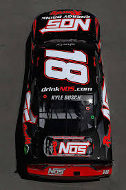 Kyle busch, driver of the nos energy drink toyota, celebrates from on top of his car after winning the nascar nationwide series o'reilly 300 at texas motor speedway on april 4, 2009 in fort worth 10 Nos Energy Drink Ideas Energy Drinks Energy Kyle Busch