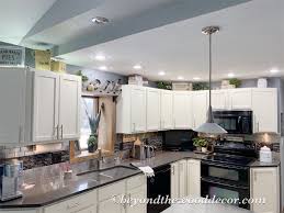 The primary guiding force behind how to deal with the space above your cabinets is whether or not you need it for storage. Decorating Above Kitchen Cabinets Beyond The Wood Diy Tips And Tricks